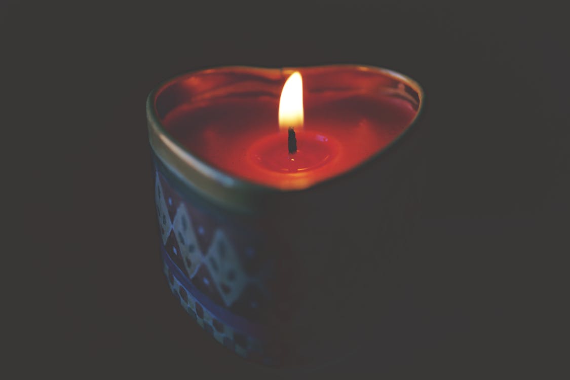 Close-up of Tea Light Candle Against Black Background