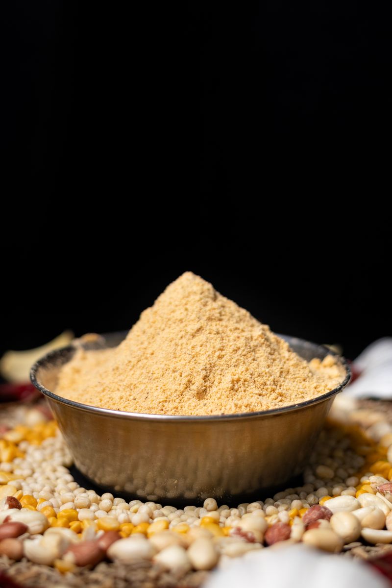 Indian spice masala in a bowl with assorted grains
