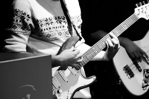 Musician playing electric guitar at a rock concert in Ankara, Türkiye.