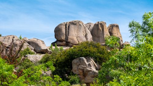 Free Beautiful granite rock formations surrounded by lush greenery in Manzanares el Real, Spain. Stock Photo