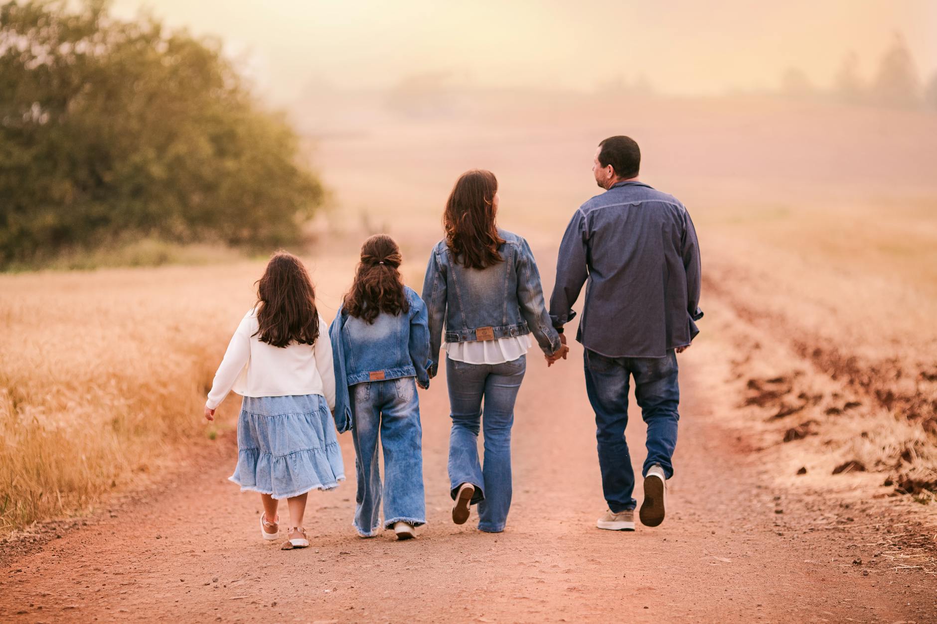 https://www.pexels.com/photo/family-walking-together-on-rural-country-road-32147474/
