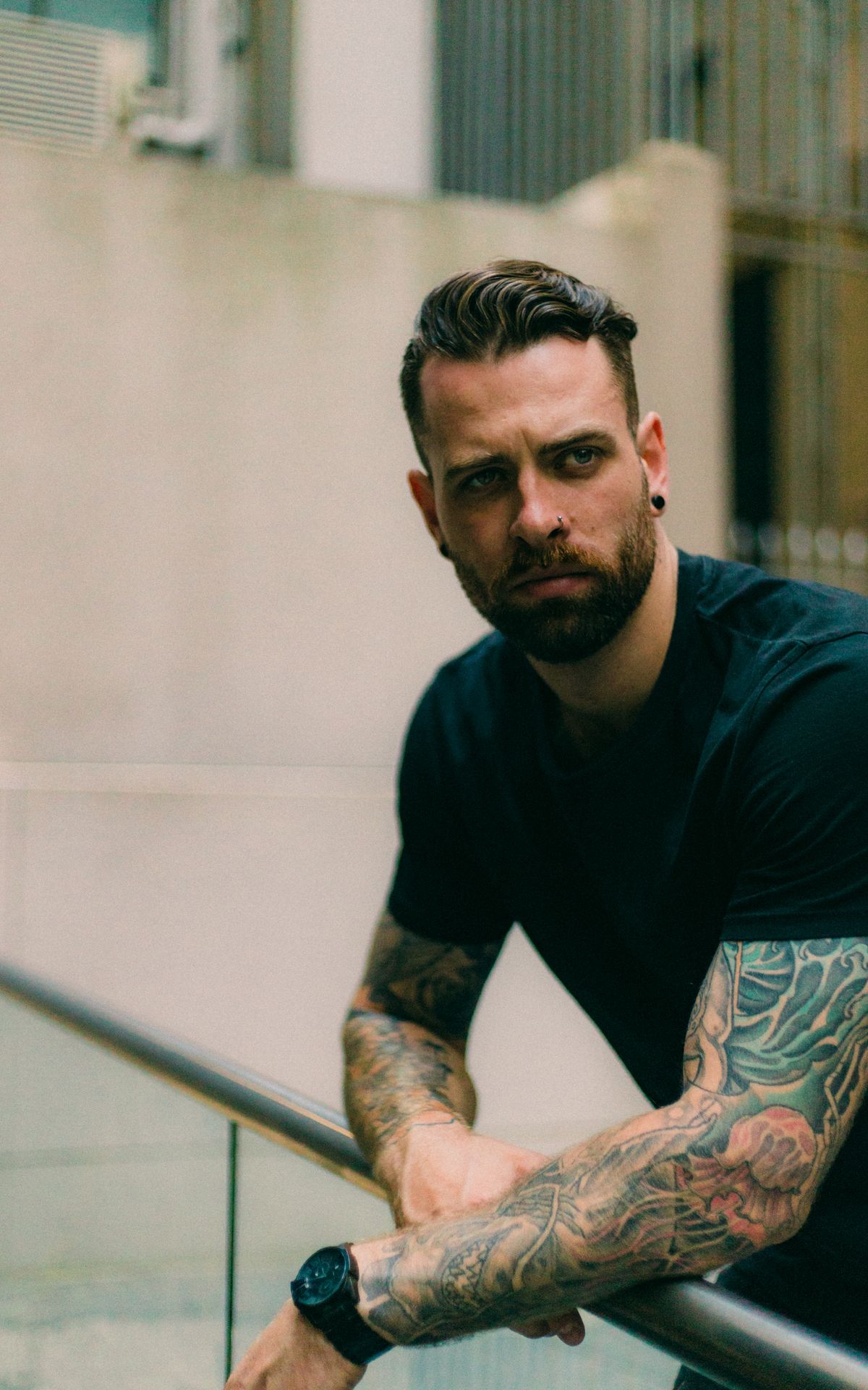 Man showing full sleeve tattoos