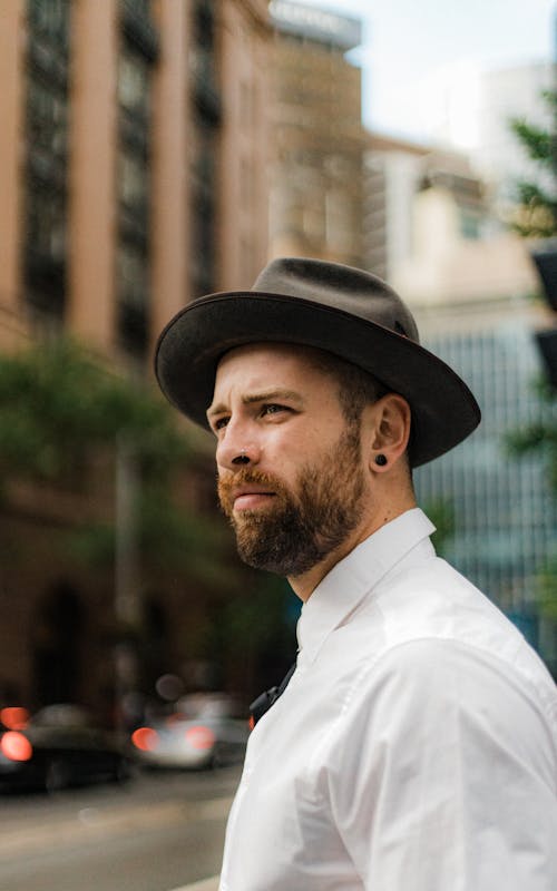 Free Man Wearing Gray Fedora Hat Out In The City  Stock Photo