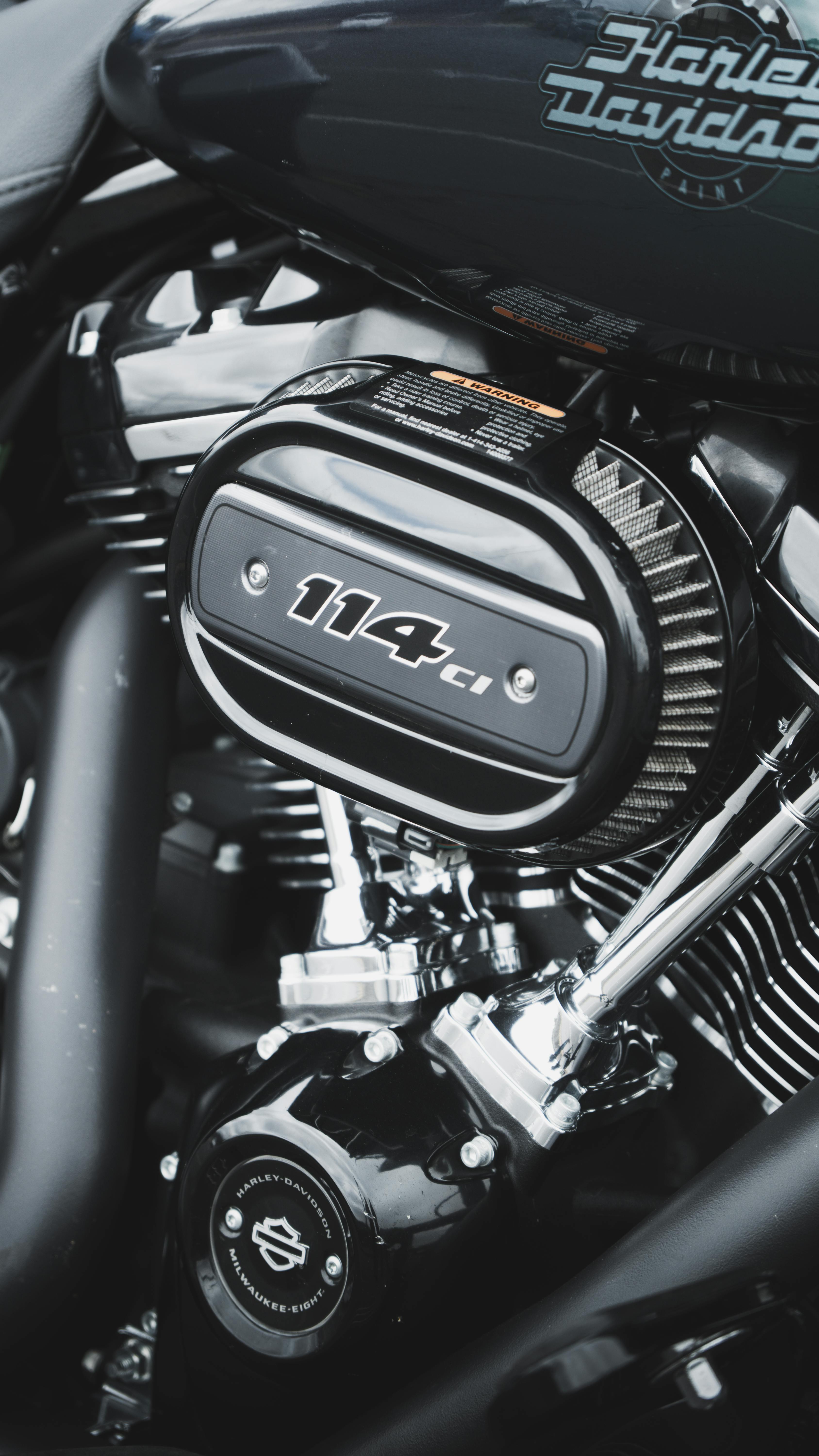Detailed view of a black Harley-Davidson motorcycle engine showcasing the 114ci label.