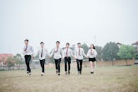 Group of Students Running Joyously Outdoors