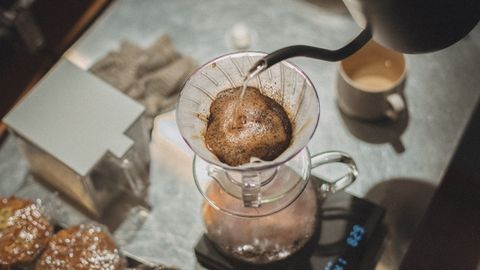 A close-up of hand-brewed pour over coffee being prepared in a Tokyo cafe.