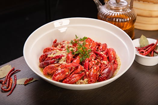 A mouthwatering Cajun seafood dish featuring crawfish in a white bowl, perfect for seafood enthusiasts.