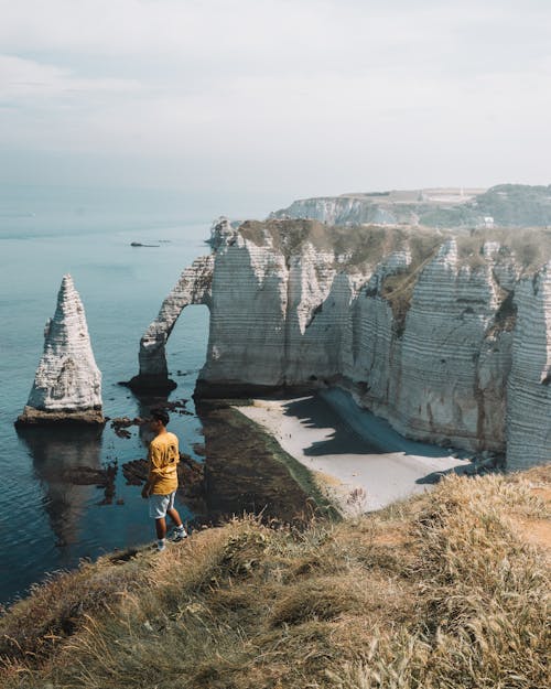 Man Standing on Cliff