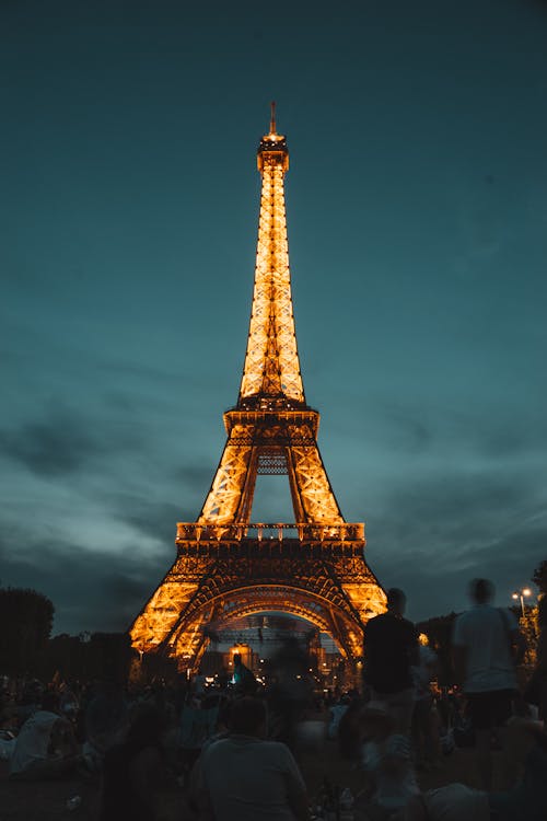 Free People Standing Under Eiffel Tower Stock Photo