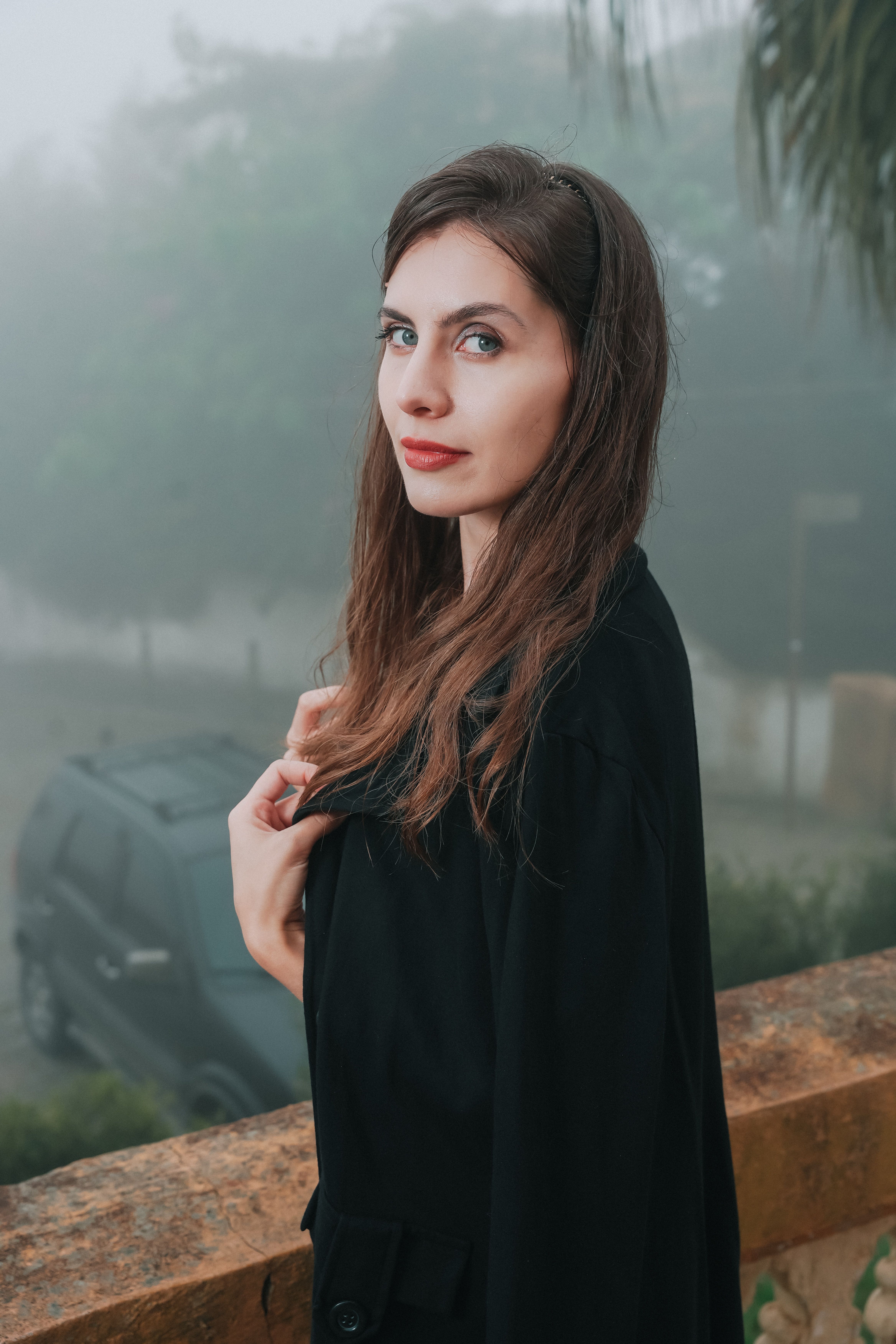 Portrait of a Woman in a Misty Outdoor Setting · Free Stock Photo