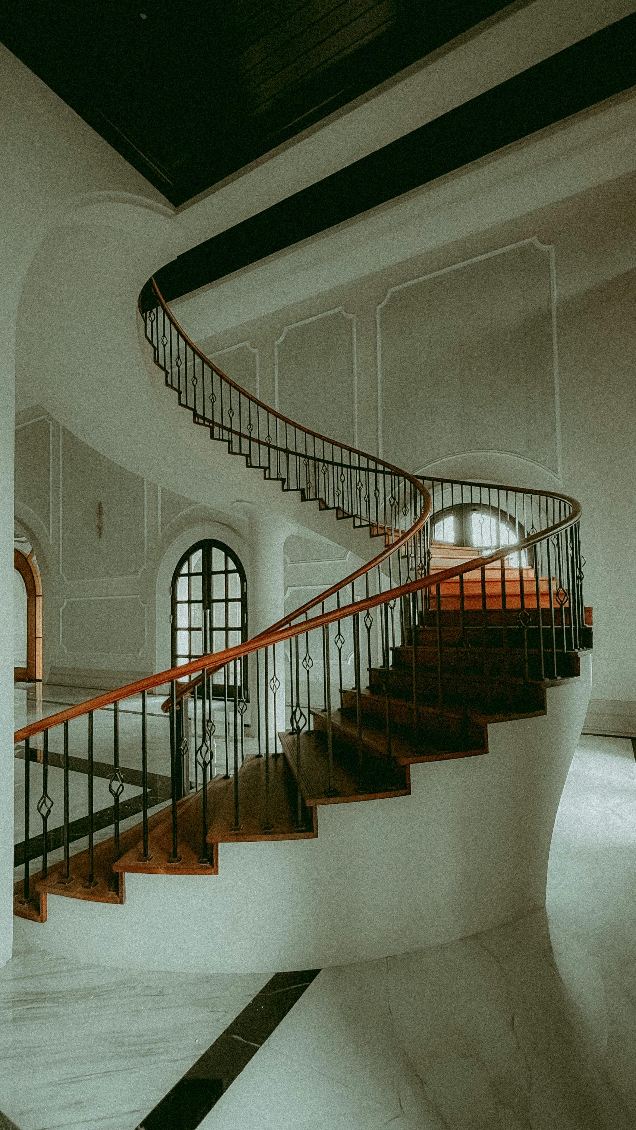 Staircase with natural lighting from skylights creating dramatic shadows