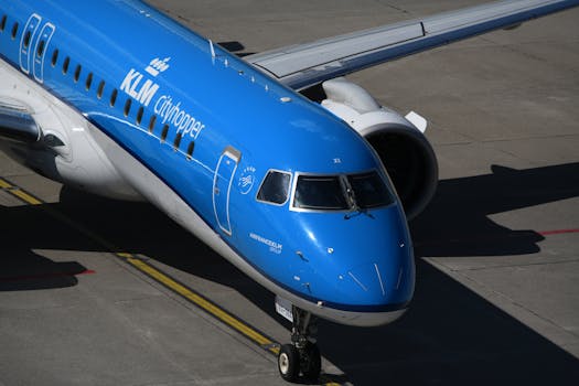 Aerial view of KLM Cityhopper aircraft preparing for departure on a sunny day.