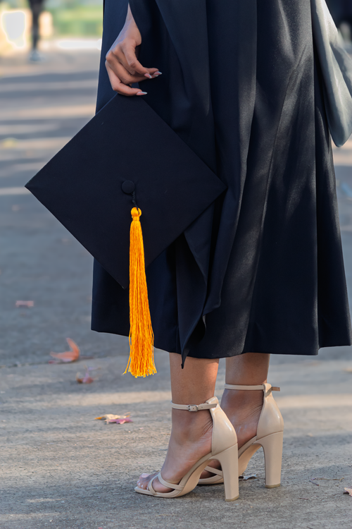 Graduation Celebration with Mortarboard and Gown · Free Stock Photo