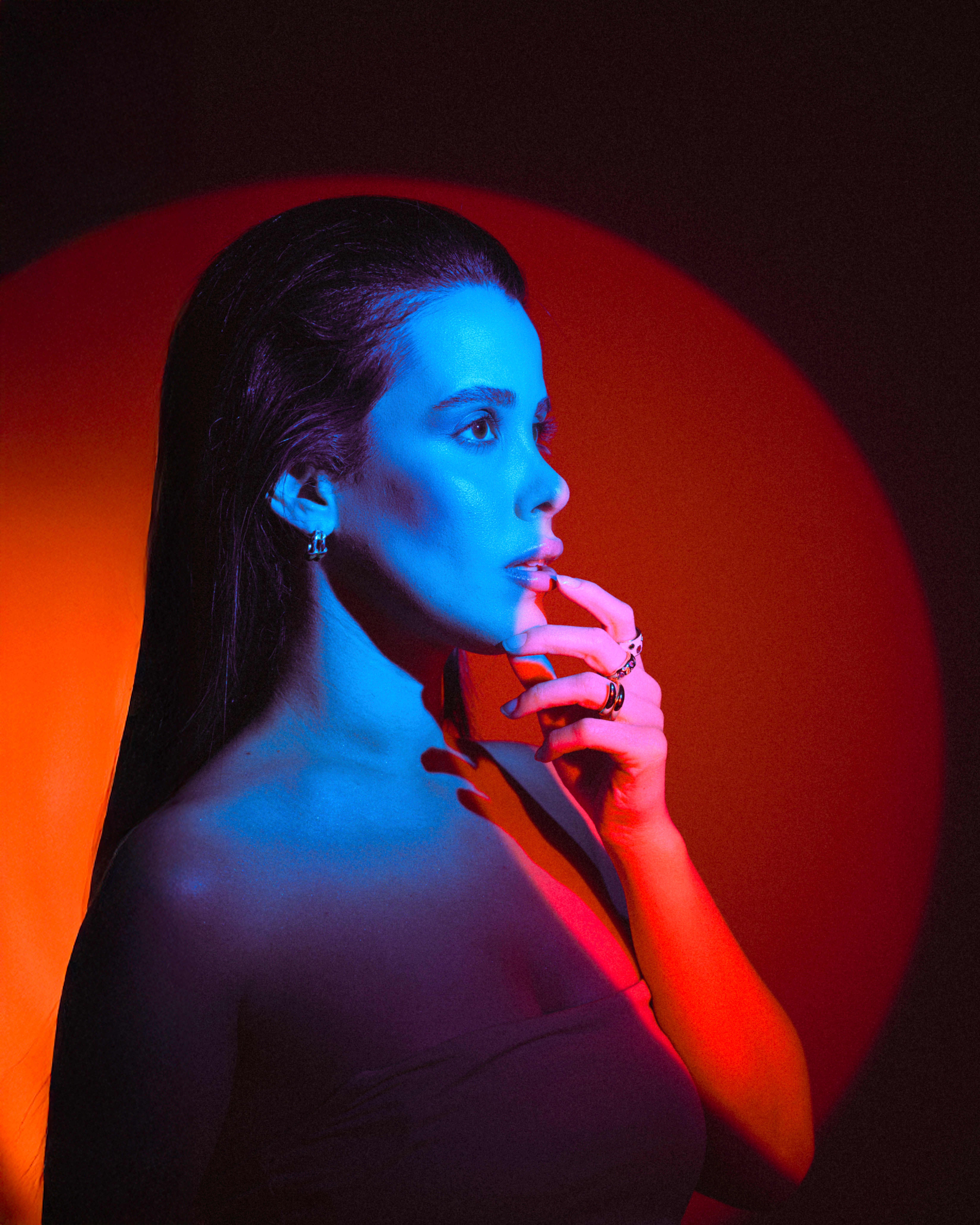 Dramatic Female Portrait with Blue and Red Lighting · Free Stock Photo