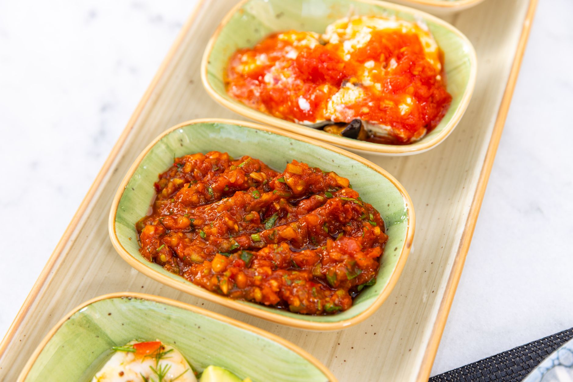 Blender filled with fresh ingredients for restaurant-style salsa
