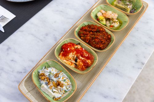 Free A vibrant assortment of Mediterranean mezze on a marble table, perfect for dining. Stock Photo