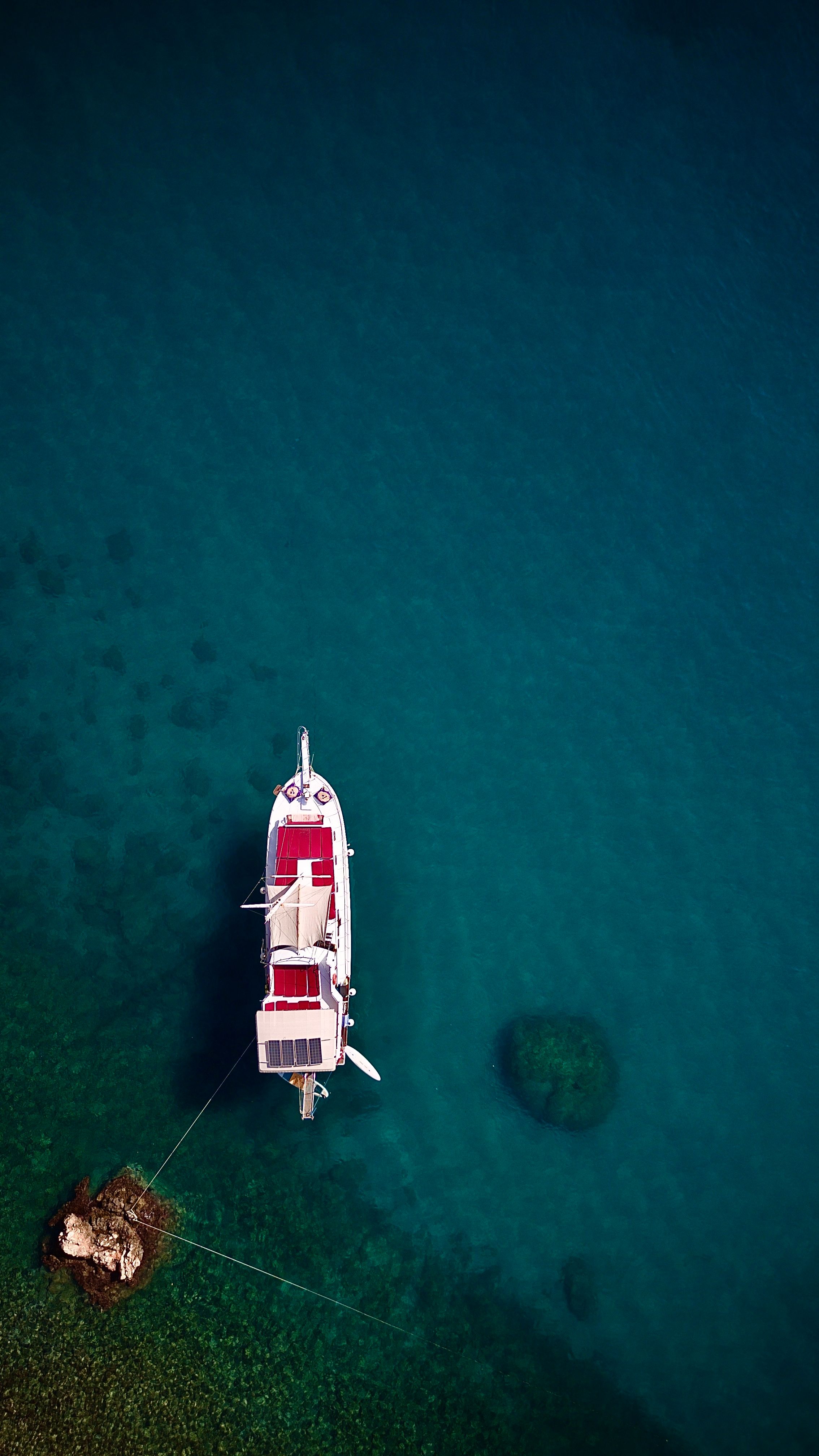 Aerial View of a Lonely Boat on Turquoise Water · Free Stock Photo
