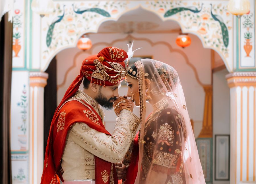 Romantic Indian wedding couple portrait in traditional attire