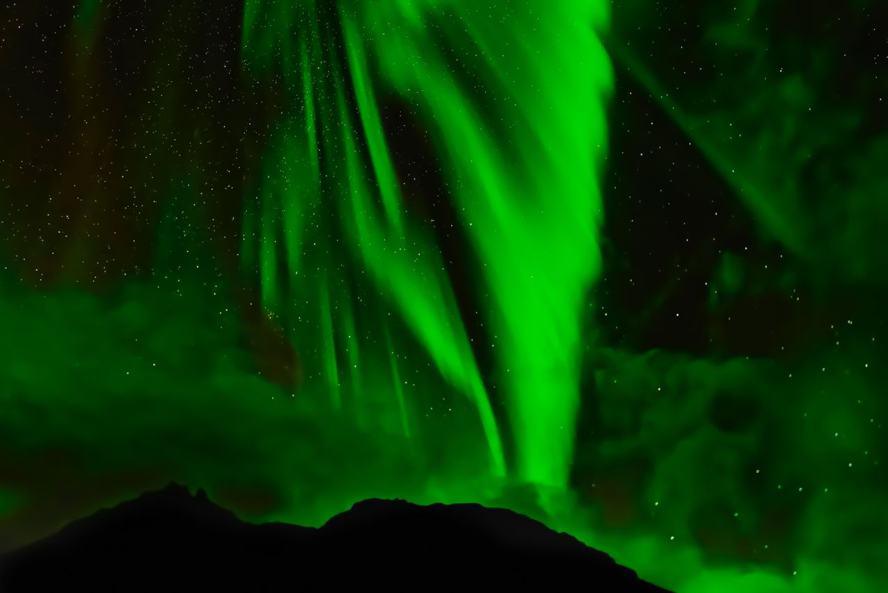 captivating view of green aurora borealis lighting up the night sky ab