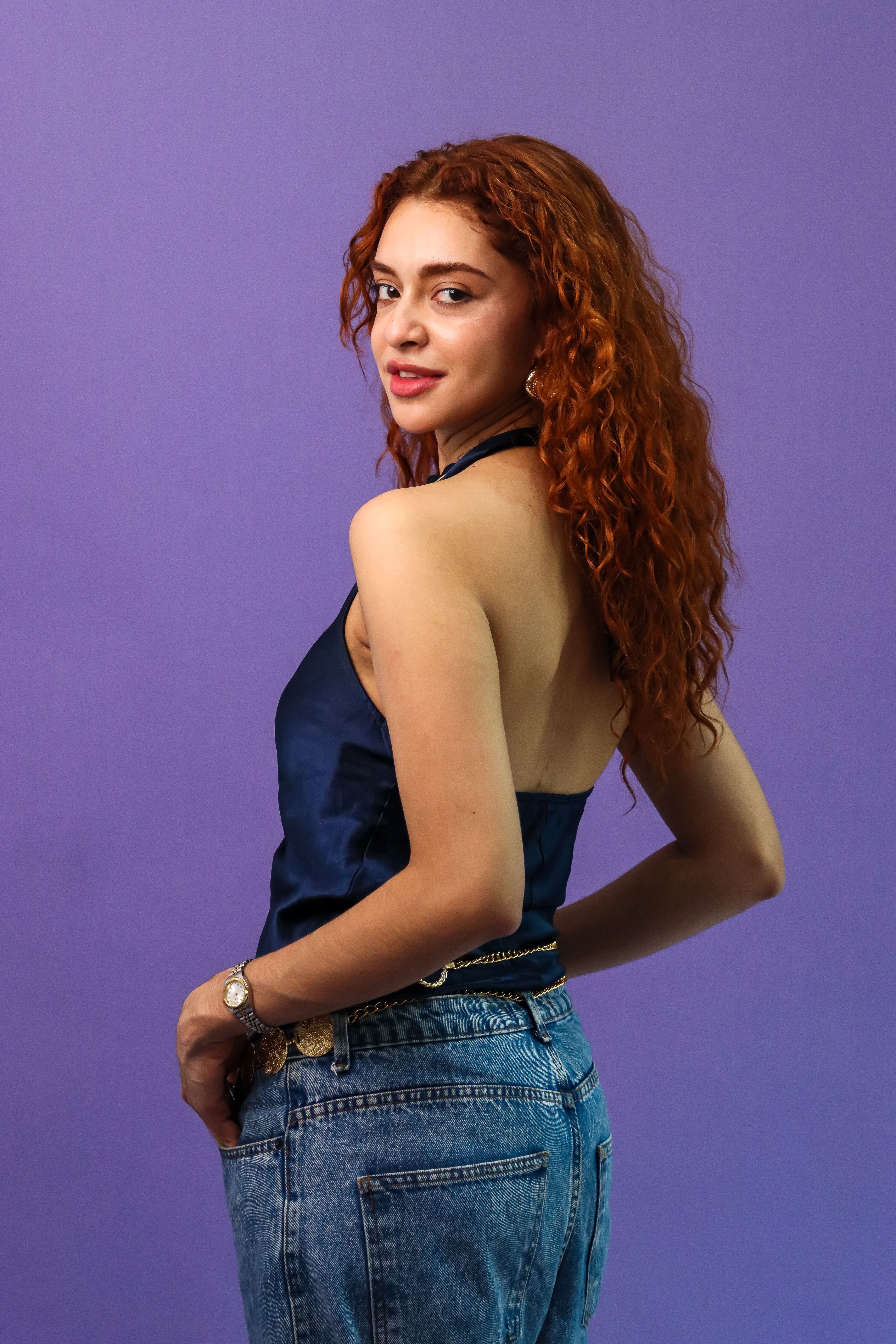 Portrait of a Woman in Blue with Purple Background · Free Stock Photo