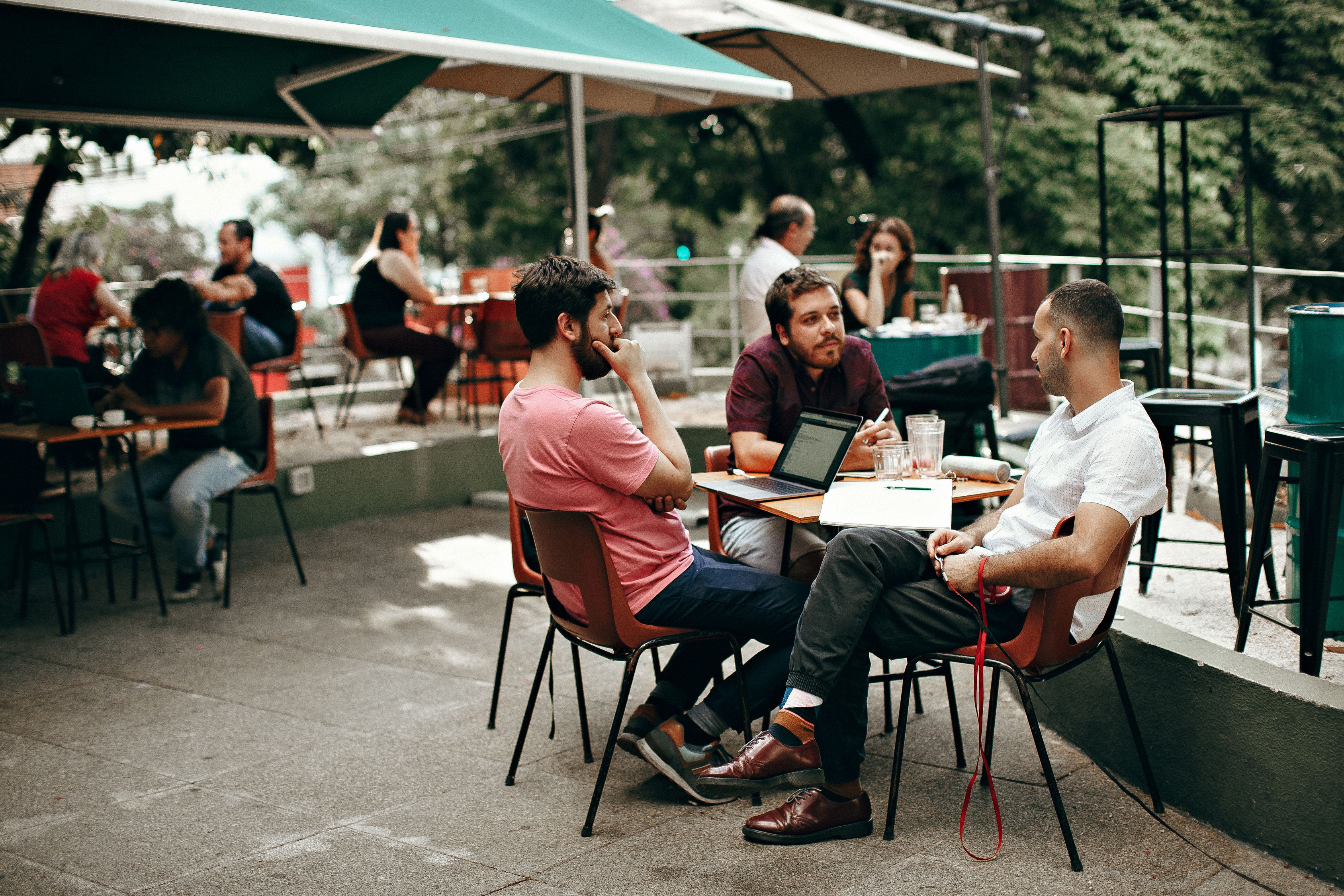 Three Men Sitting at the Table · Free Stock Photo