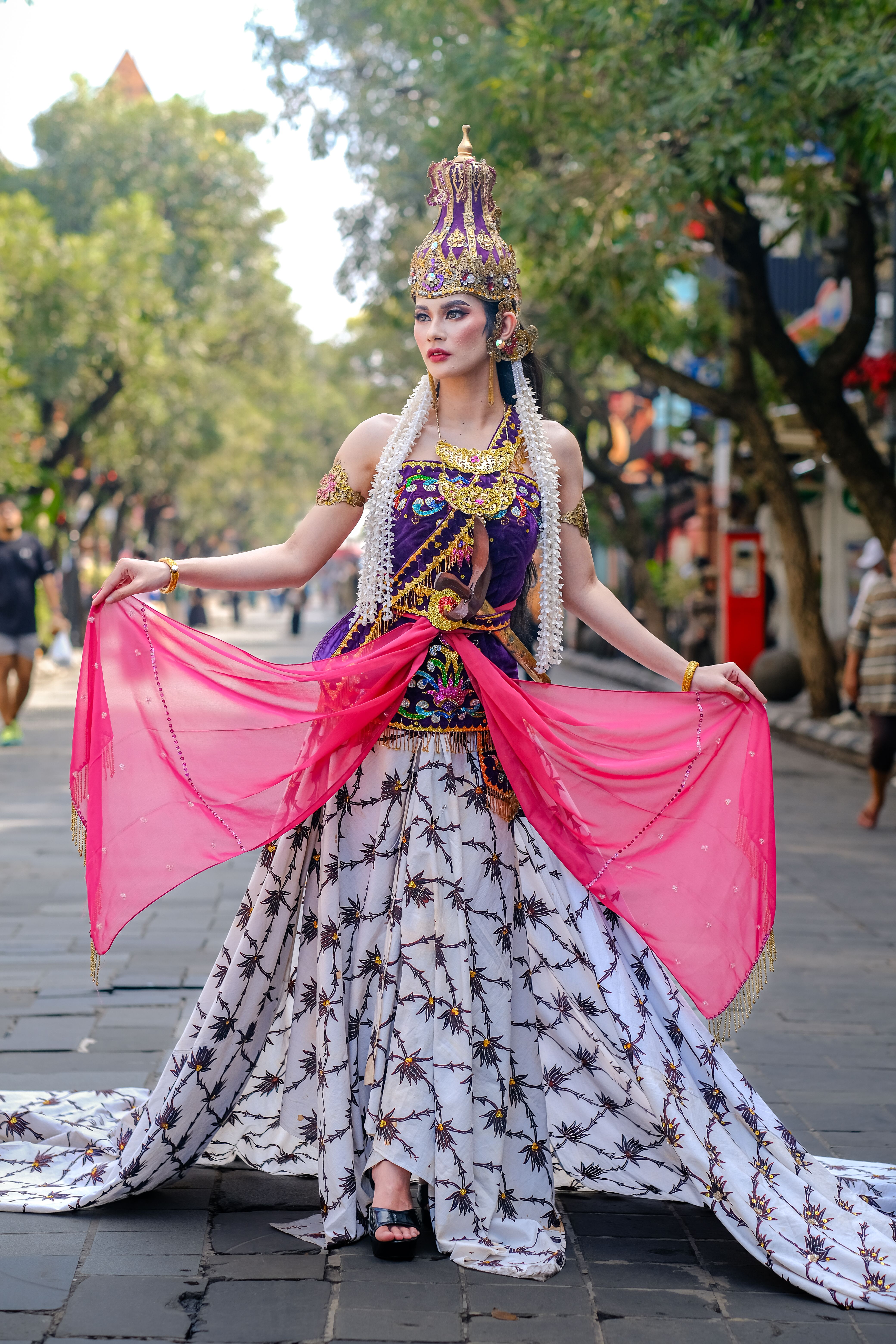 Elegant portrayal of Indonesian cultural attire on a street in West Java.