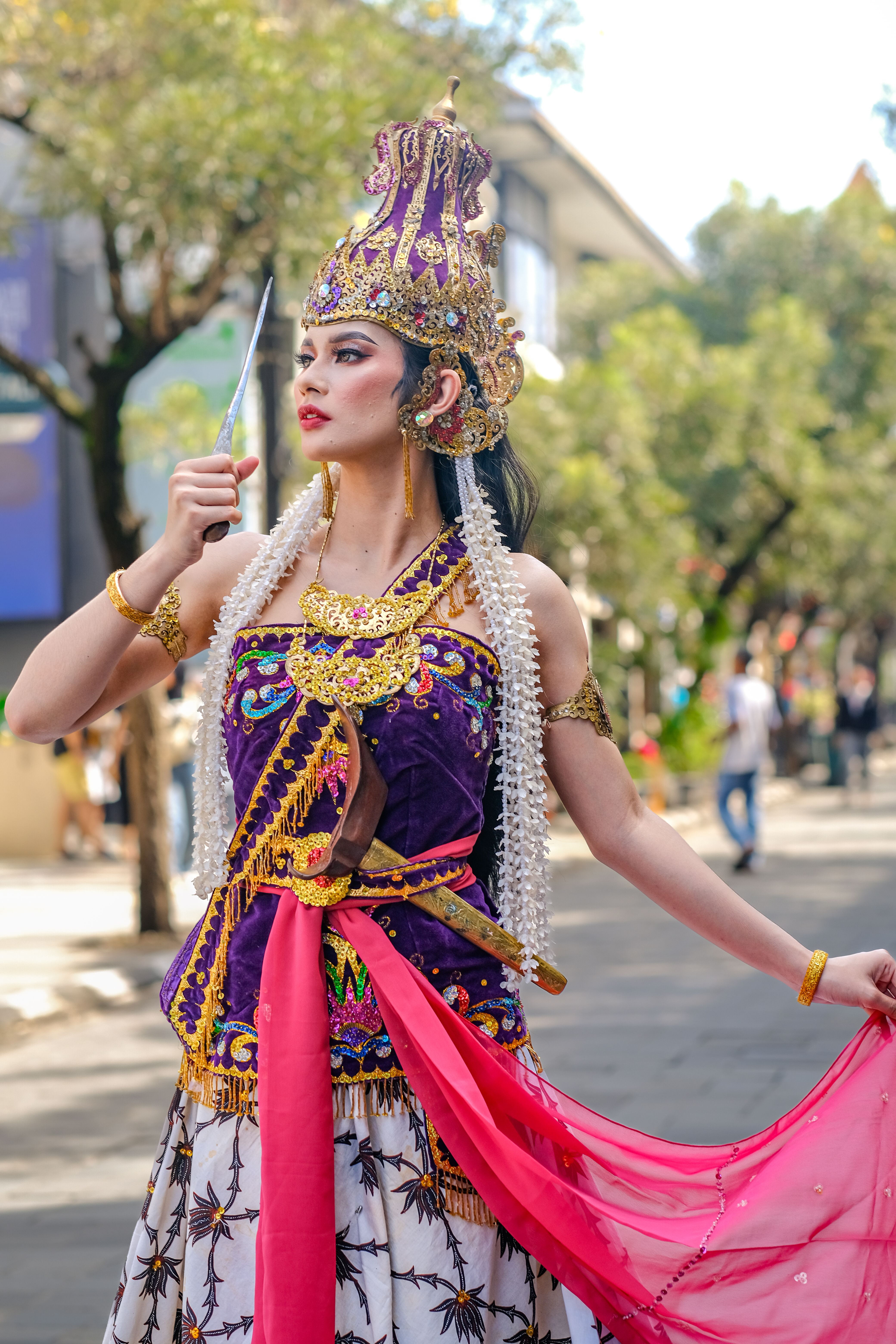 Elegant display of traditional Indonesian attire during a street performance in Bandung, West Java, Indonesia.