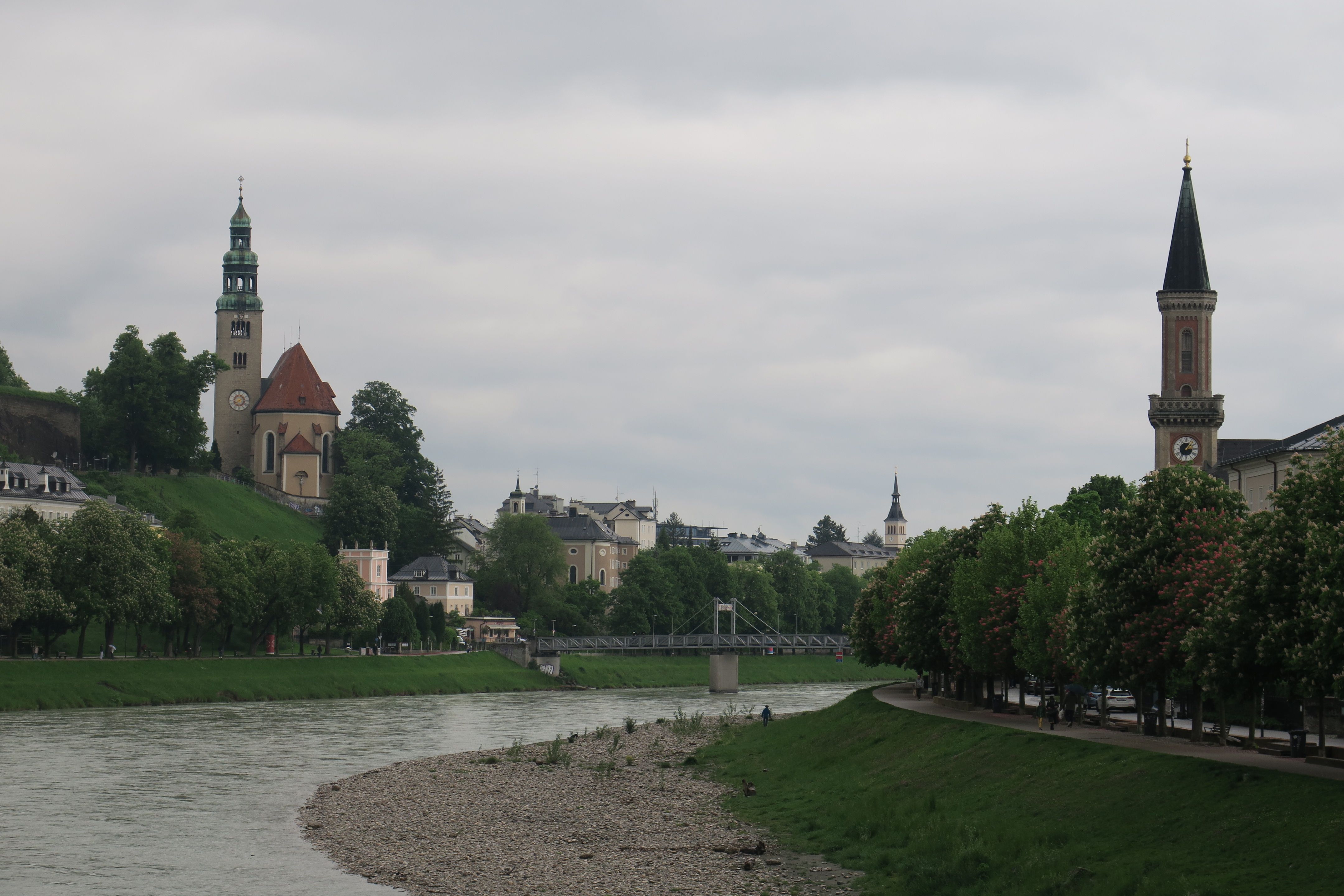 Original Sound of Music Tour bus passing scenic landscapes in Salzburg, Austria