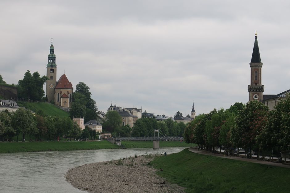 Original Sound of Music Tour bus passing scenic landscapes in Salzburg, Austria