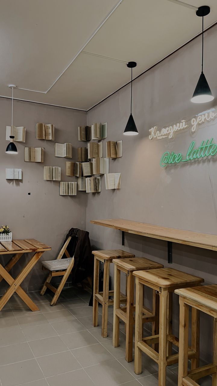 fold down wall table mounted in a kitchen corner used as a small coffee bar