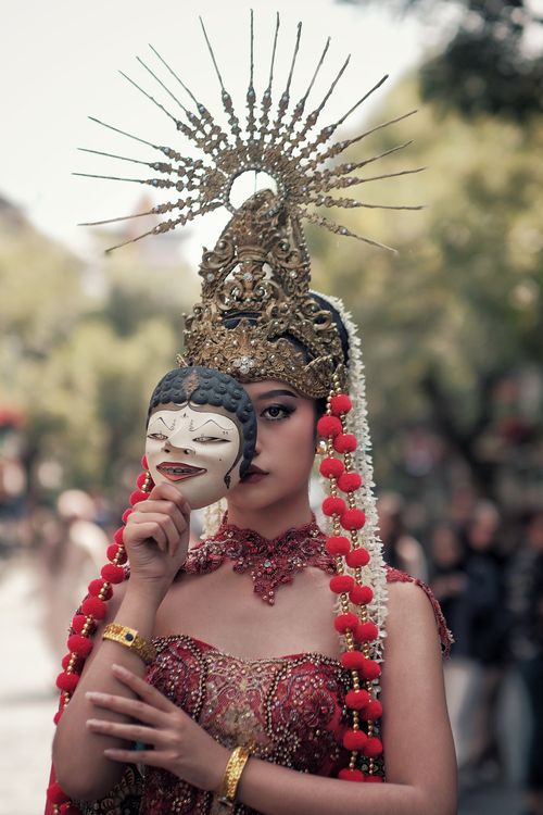 Free Elegant dancer in traditional attire holding a mask in West Java, Indonesia. Stock Photo