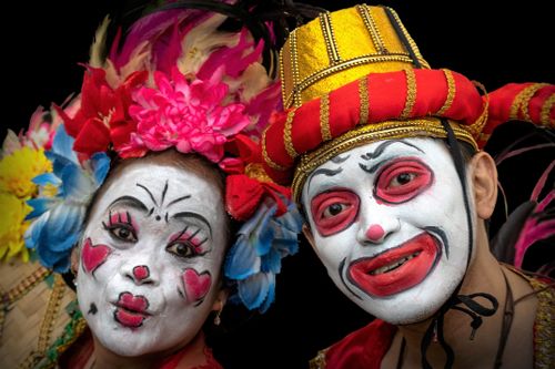 Free Vibrant portrait of people in playful traditional costumes during an Indonesian festival, showcasing cultural richness. Stock Photo