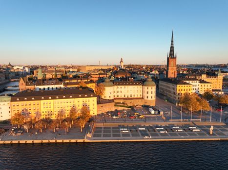 Stunning aerial view of Stockholm's historic architecture bathed in sunset light.
