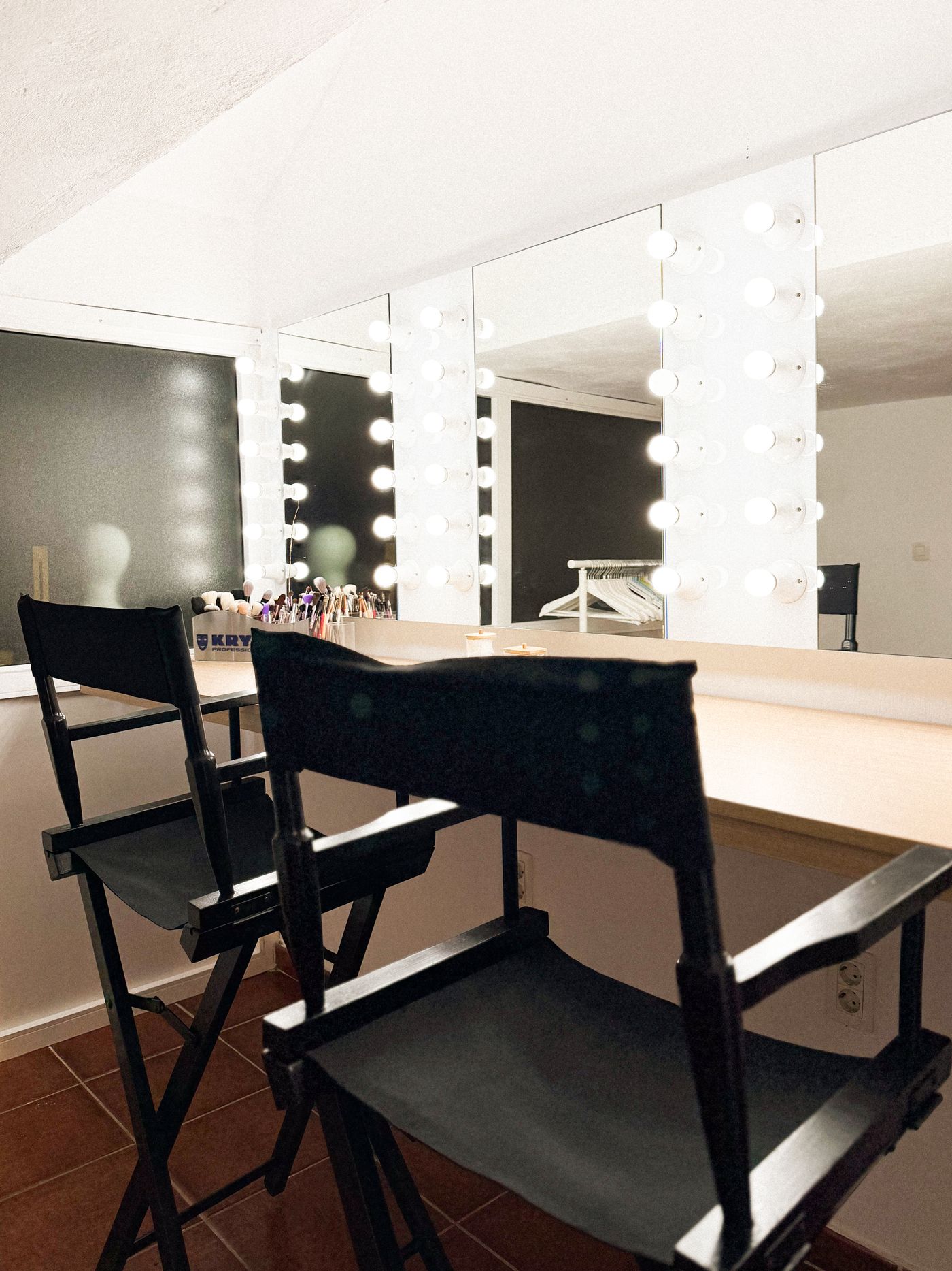 Makeup studio with illuminated vanity mirrors