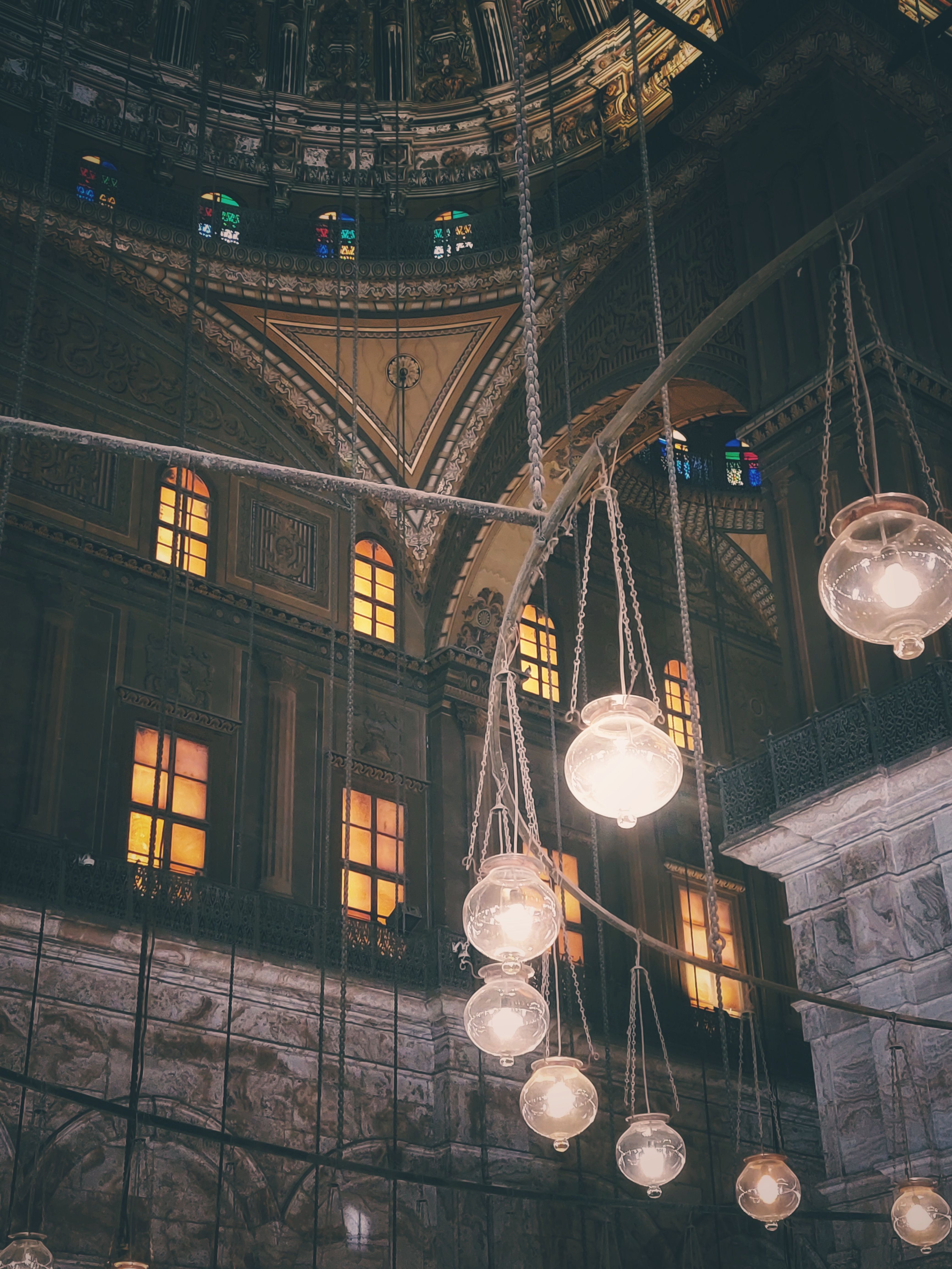 Elegant view of a mosque interior showcasing detailed architecture and serene lighting.