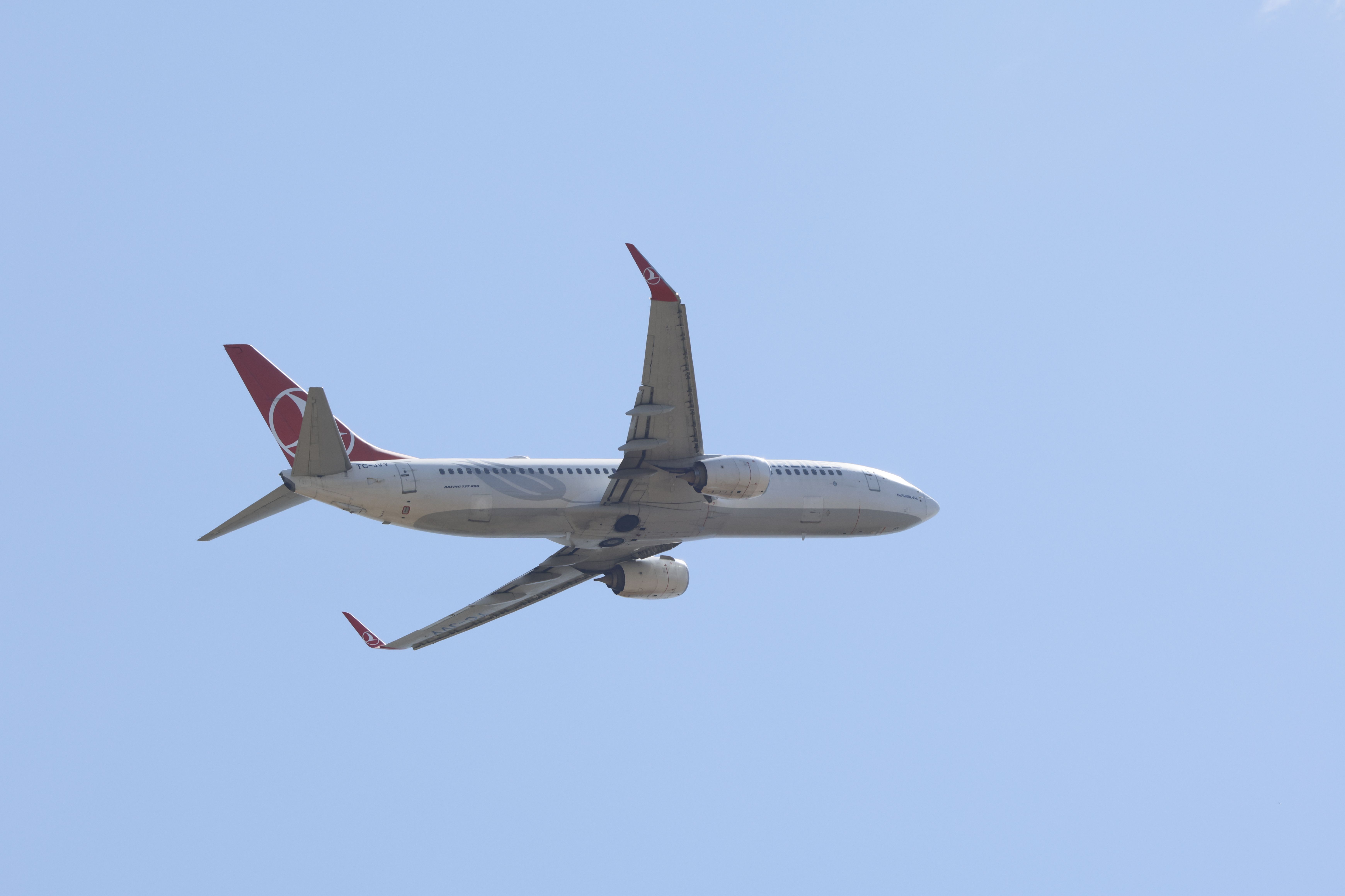Passenger Airplane Flying in Clear Blue Sky · Free Stock Photo