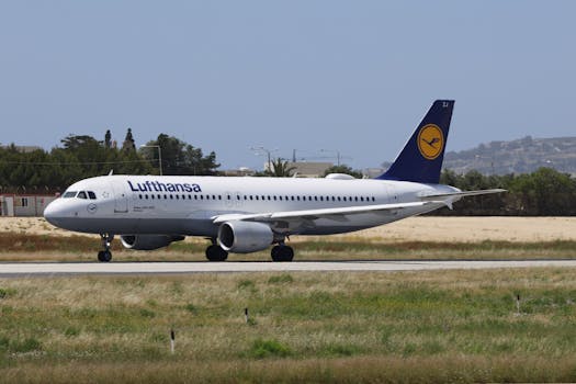 Lufthansa Airbus A320 taxiing on a runway during daytime, captured outdoors.