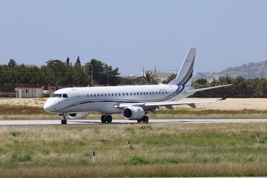 A sleek private jet on the runway, ready for takeoff under clear skies.