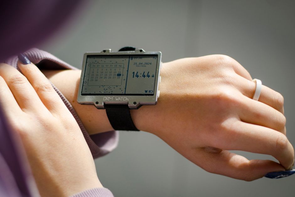 Close-up of a user monitoring training load on a Marathon wearable health tracker