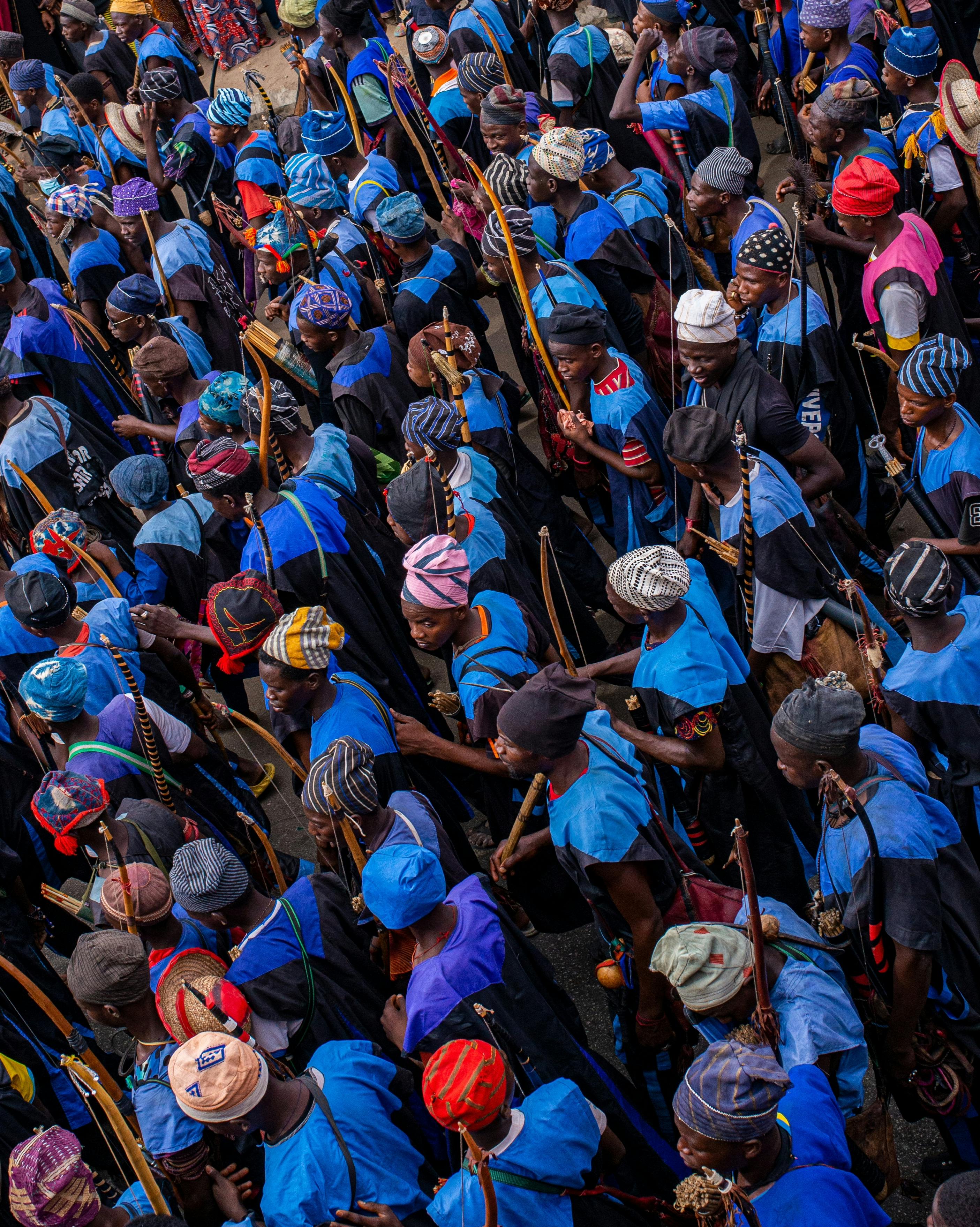 A vibrant aerial shot of a cultural gathering with people in colorful traditional attire.