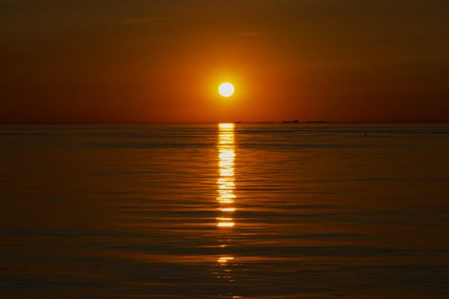 Free Stunning sunset view over the calm waters of Yalova, Türkiye with a warm glow. Stock Photo