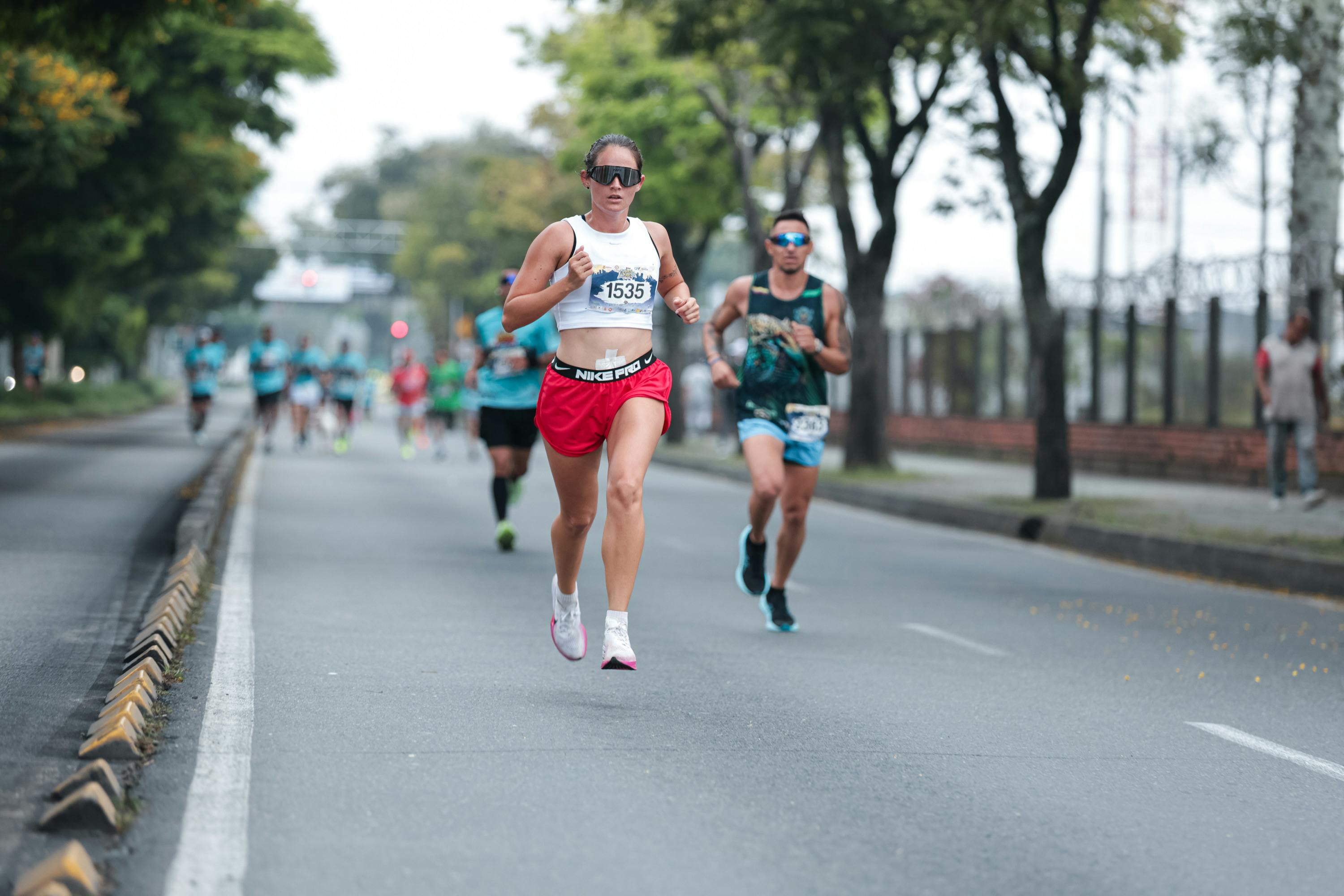 closeup of runner applying anti-blister balm to foot before race