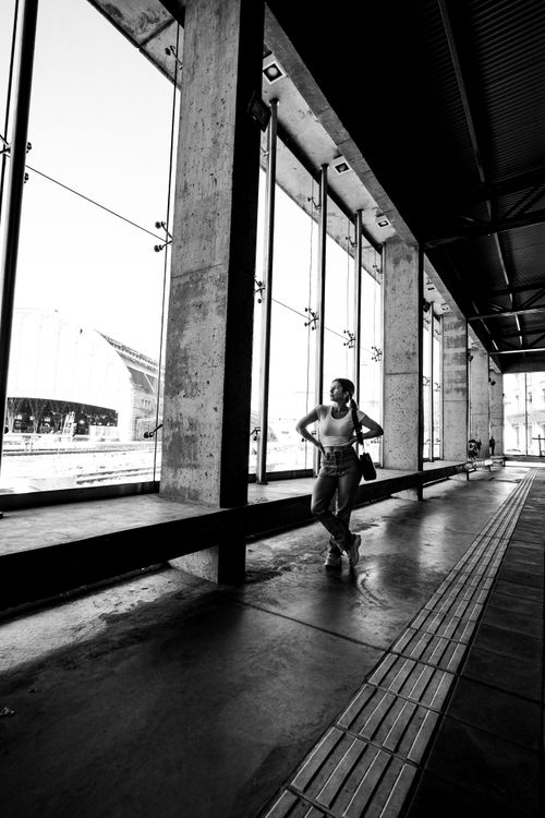 Free A woman stands inside a modern building in Buenos Aires, Argentina. Stock Photo