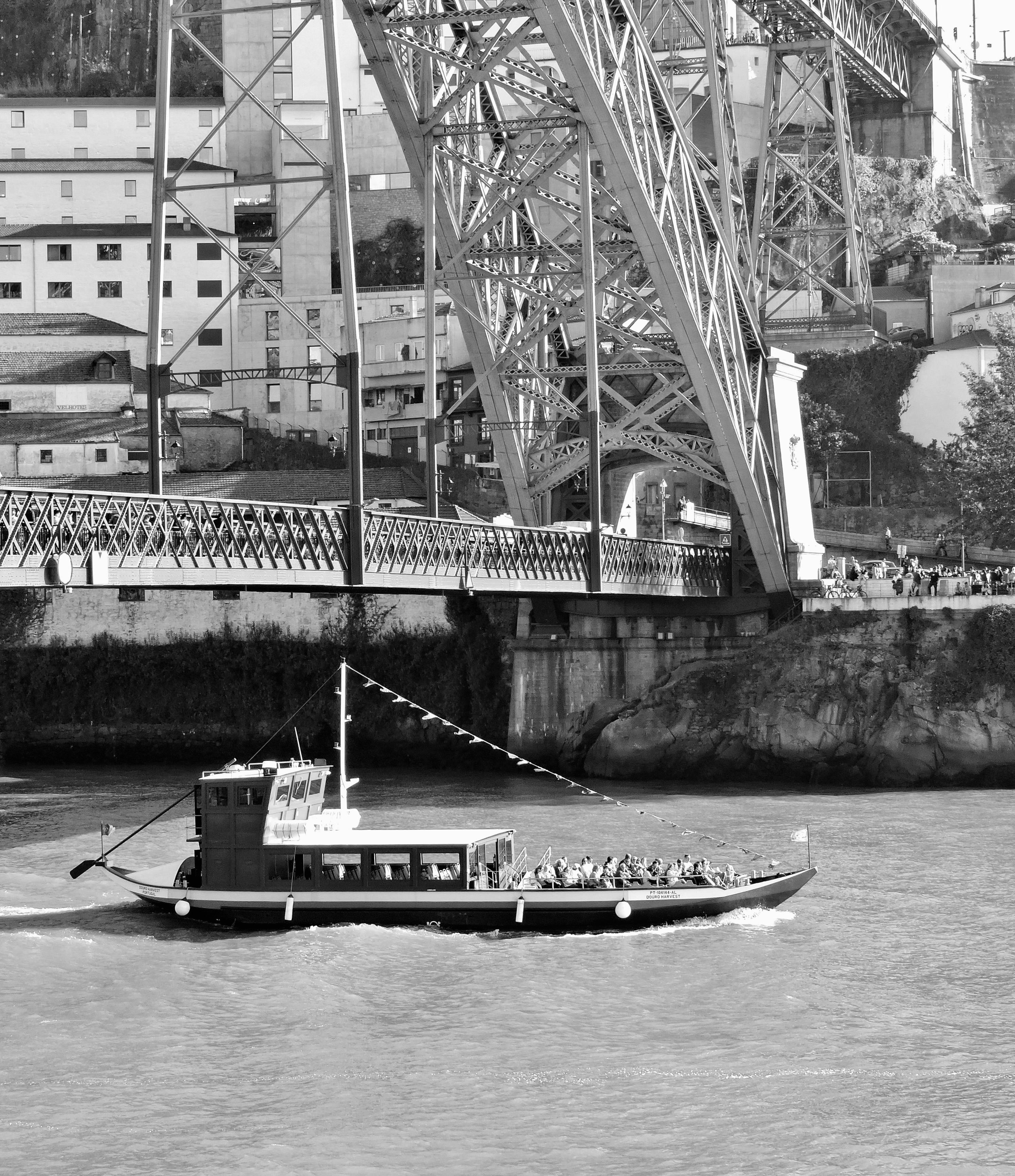 Black and White Boat under Steel Bridge · Free Stock Photo