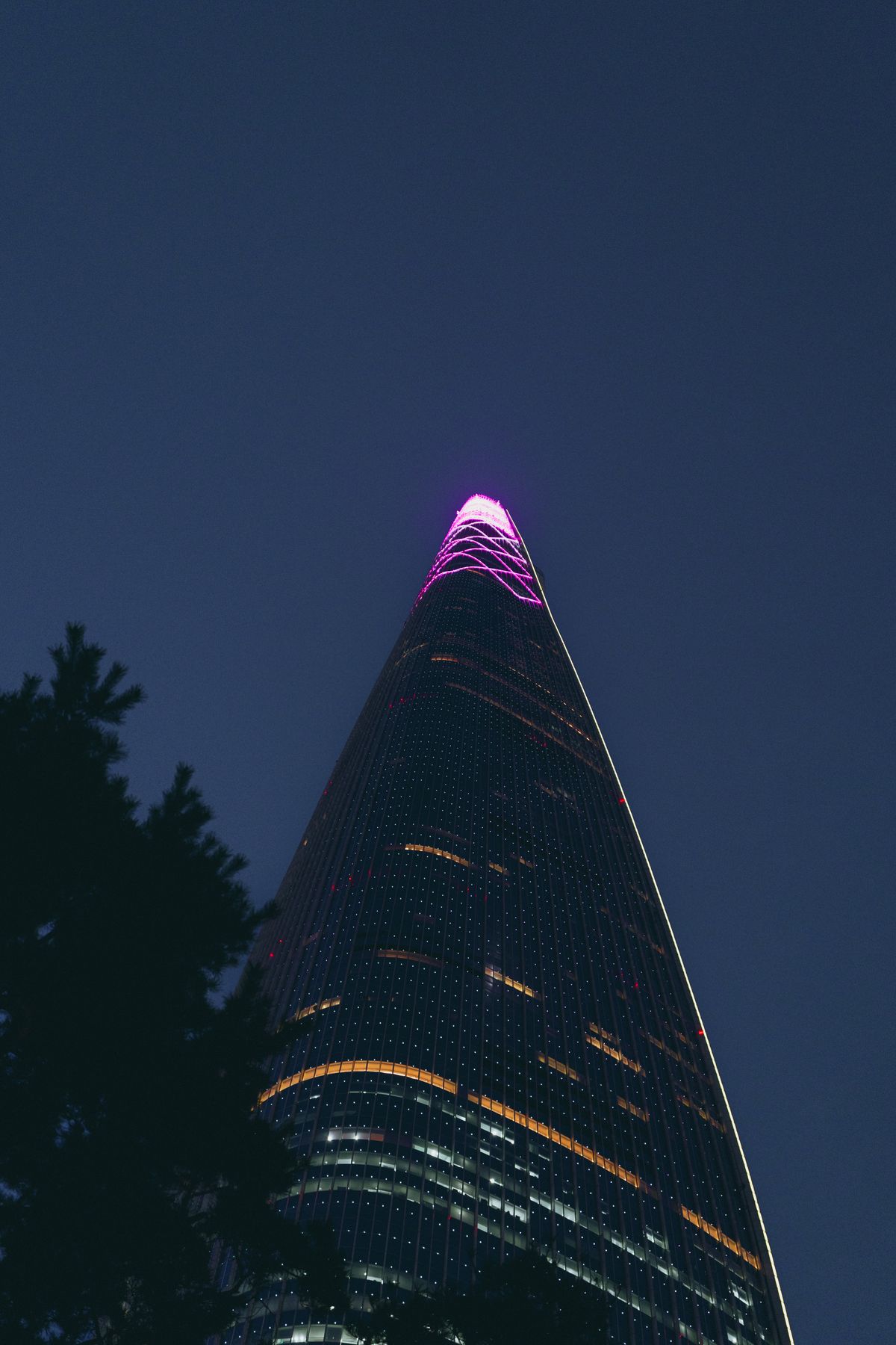 Lotte World Tower illuminated at night. A photograph does not confirm current opening hours or admission.