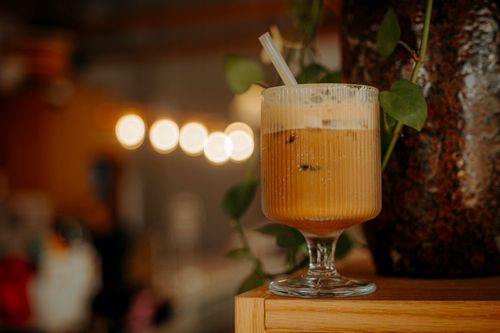 Free Close-up of a refreshing iced coffee in a stylish glass, perfect for summer. Stock Photo