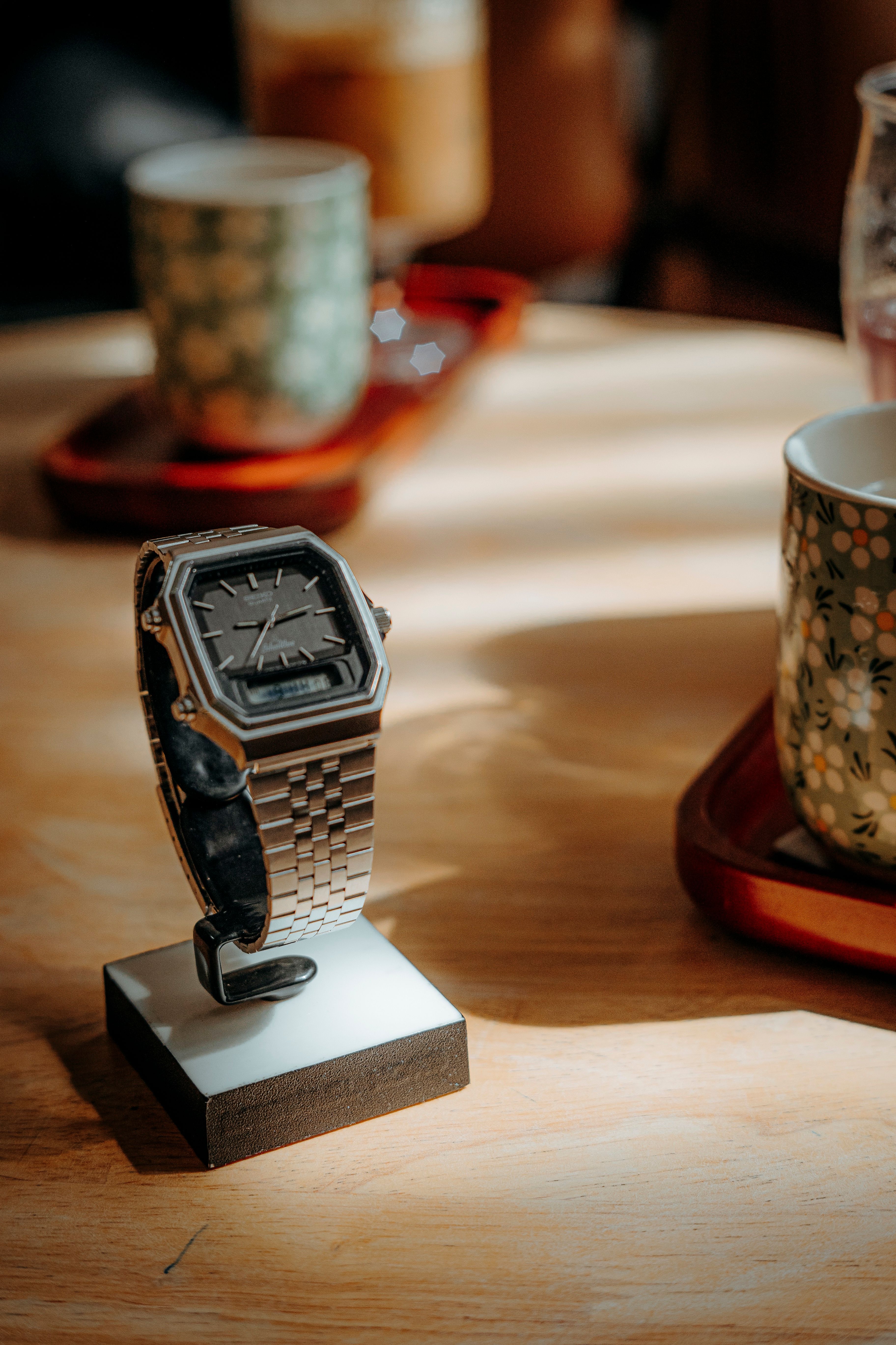 Elegant Watch Display in Cozy Café Setting · Free Stock Photo