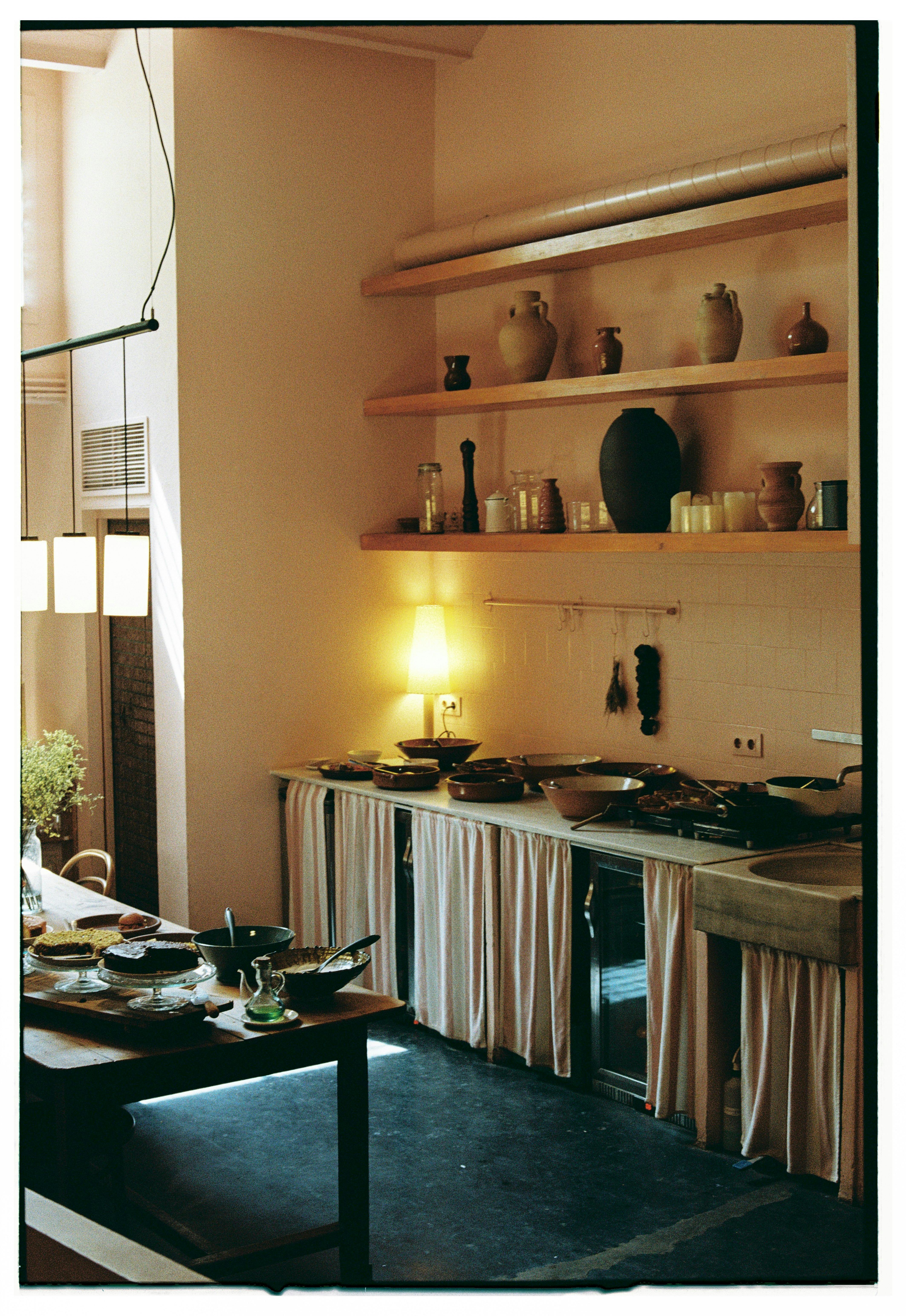 Charming vintage kitchen interior with warm lighting and rustic decor, perfect for homely vibes.