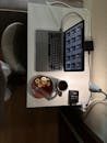 Modern Workspace with Laptop and Breakfast Setup
