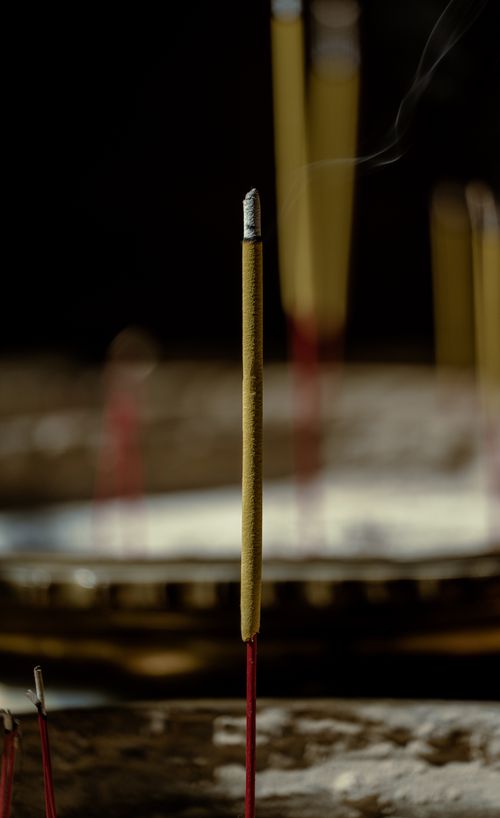 Free Close-up of a burning incense stick in a temple in Ho Chi Minh City, Vietnam, exuding spirituality and tranquility. Stock Photo